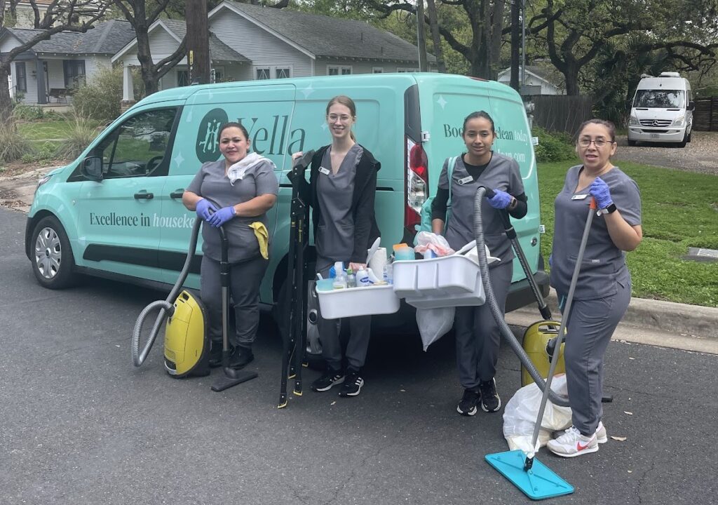 A team of house cleaners with supplies and a branded van, ready for house cleaning with pets.