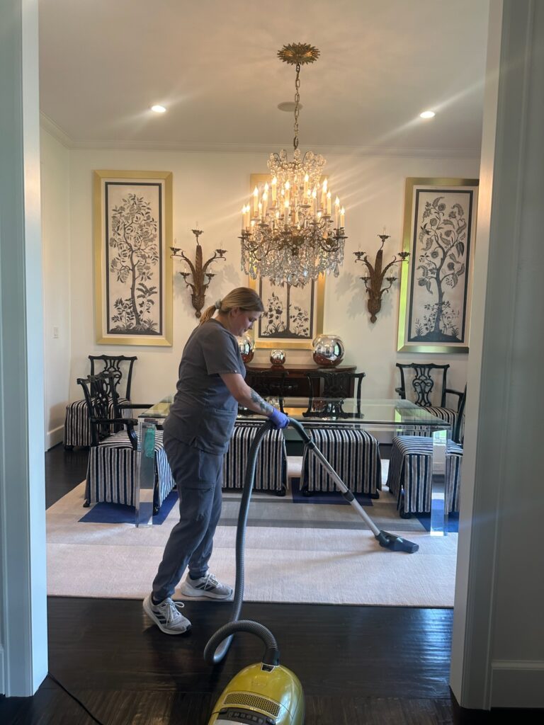 Vella’s staff vacuumed the dining room floor.