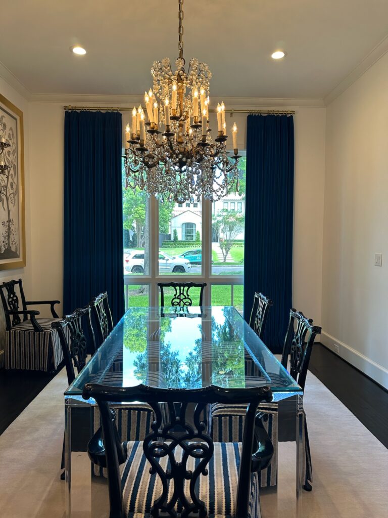 Spotless dining table with simple place settings inside an Austin home after Vella’s professional furniture cleaning.