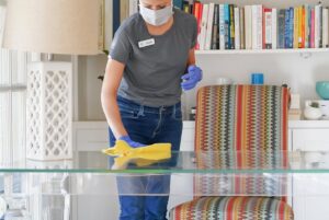 Microfiber cloth as an eco-friendly alternative to feather dusters, trapping dust with a reusable and nontoxic cleaner.